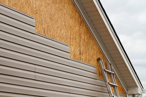 Professional Vinyl Siding technician working in Greensburg, IN
